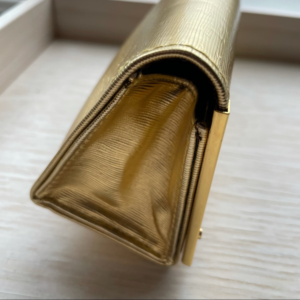 Tory Burch gold tone fold over sunglass case